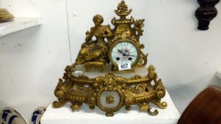 A French style gilt clock with pendulum marked Henri Marc's, Paris on movement,