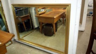 A gilt framed bevel edged mirror