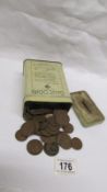 A tin of early 20th century copper pennies and half pennies etc