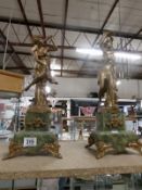 A pair of French gilded figures on marble bases (possibly clock side pieces)