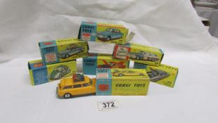 7 boxed Corgi toy cars in various conditions including Volkswagen police car, Plymouth U.S.