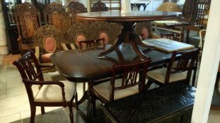 A mahogany effect dining table and 4 chairs