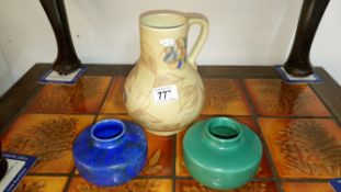 A chameleon ware jug and 2 squat vases