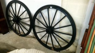 A pair of old cart wheels