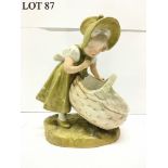 A Royal Dux figure of a girl with basket