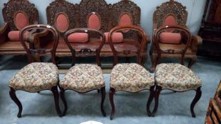 A set of 3 + 1 mahogany balloon back dining chairs