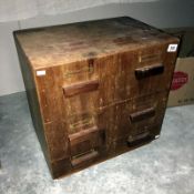 An oak filing cabinet with 6 drawers