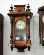 A small mahogany Vienna wall clock