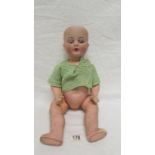 A 19th century bisque headed doll with composition body marked A M Koppelsdorf, Germany, 990 A7M a/f