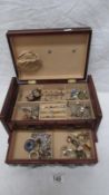 A jewellery box containing assorted costume jewellery