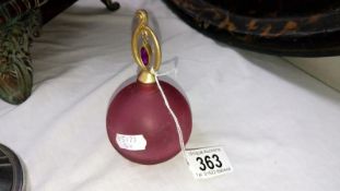 A pink glass perfume bottle