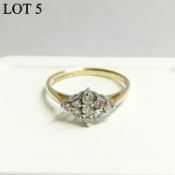 A diamond cluster set with nine diamonds in 9ct gold,