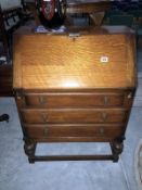 A 1930's medium oak bureau