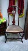 An Edwardian mahogany nursing chair