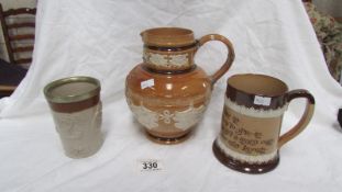 A Doulton stoneware jug (repaired),