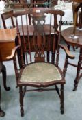 A 19th Century oak country chair with upholstered seat