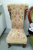 A Victorian mahogany tapestry upholstered nursing chair