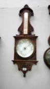 A 1930's Aneroid barometer with porcelain face
