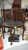 A mahogany pad foot chair with cane panels