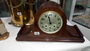 A mahogany mantel clock
