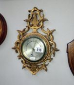 A guilded ormalu aneroid barometer
