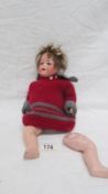 A 19th century bisque headed doll with composition body marked Armande Marsielle, Germany 990 A 30/1