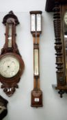 A Victorian oak stick barometer by Callaghan London