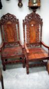 A set of 4 heavily carved carver chairs with brass inlay