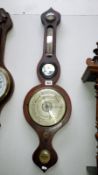 A Victorian mahogany veneered wheel barometer