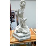 A classical figure of a semi nude female