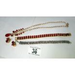 A red stone set necklace,