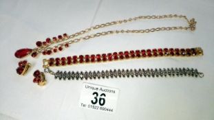 A red stone set necklace,