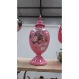 A 19th century pink hand painted glass lidded vase