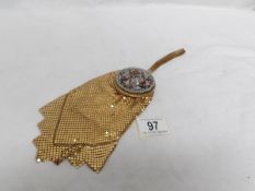 An unusual vintage beaded wrist purse with incorporated powder compact