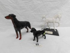 A Beswick horse and 2 dogs