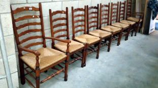 A set of 8 oak ladder back chairs