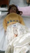 A 19th century bisque headed doll with composition body maked D R G M 246/1, A4M
