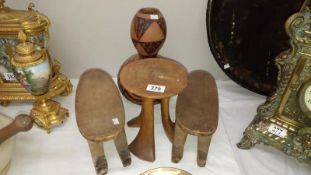 2 African head rests a stool and a Gourd vase