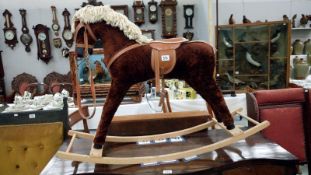 A fabric covered rocking horse