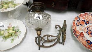 A Victorian brass Hinks wall oil lamp with cut glass font