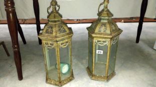 A large pair of glass metal verdigris lamps