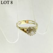 A diamond cluster ring set in 18ct gold (tested) with nine diamonds,