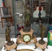 A 3 piece clock set surmounted figures