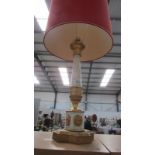 An ornate table lamp with shade