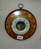 An inlaid aneroid barometer