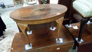 An oriental lacquered top table with Queen Anne legs