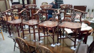 A set of 4 darkwood corner chairs heavily inlaid with Mother of Pearl
