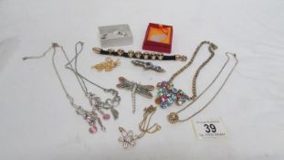 A mixed lot of jewellery including dragon fly brooch, horse earrings,