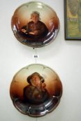 A pair of decorative wall plates