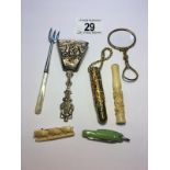 A mixed lot including Dutch caddy spoon, cheroot holder, silver fork,